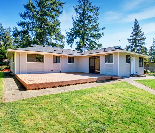 Large back deck also back yard with grass. — Stock Photo, Image