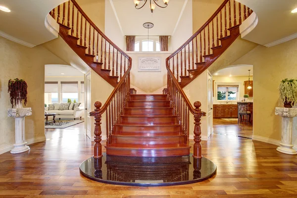 Elegant double staircase with a chandelier. — Stock Photo, Image