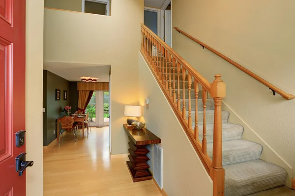 Modern entry way to home with carpet staircase. — Stock Photo, Image