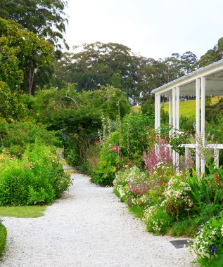 Trail in the garden near Kemp House in New Zealand clipart