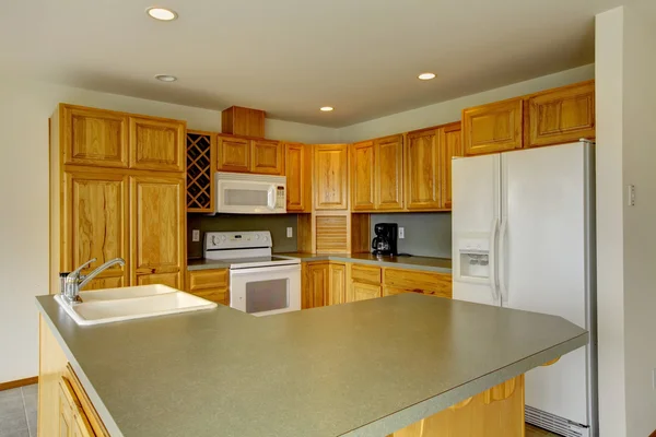 Simple kitchen with gray counter tops. — Stock Photo, Image