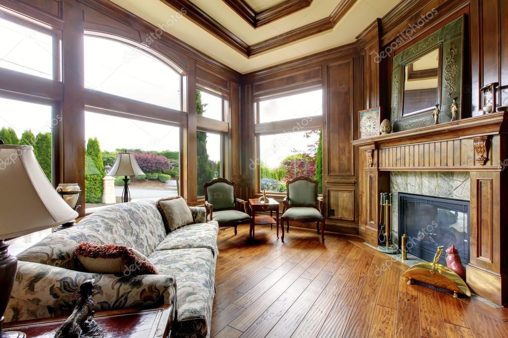 Large luxury living room with big windows.