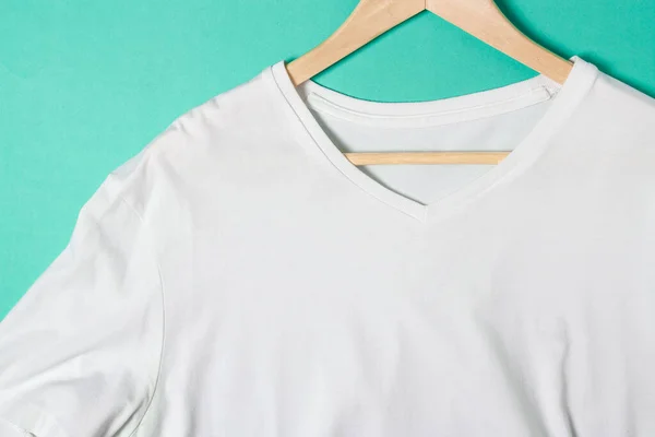 white v neck t-shirt on hanger closeup