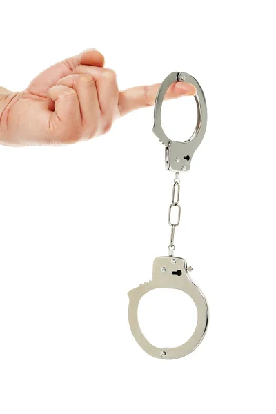 Hand with handcuffs - Stock Photo, Image. 
