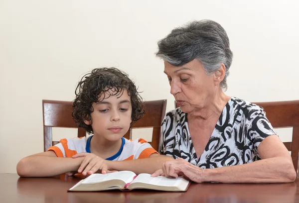 Hispanic Family Studying the Holy Bible