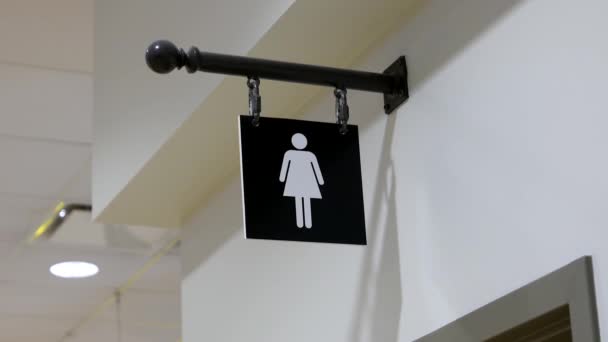 Motion of woman washroom logo on wall — Stock Video