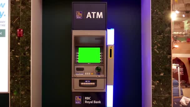 Green billboards on atm machine on wall — Stock Video