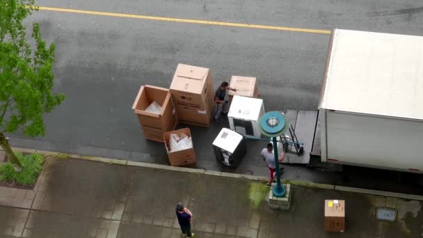 Top shot of movers unloading electric home appliances — Stock Video