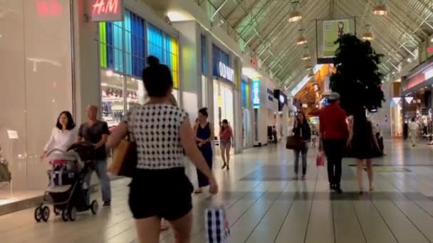 Shopper inside Coquitlam Center shopping mall — Stock Video