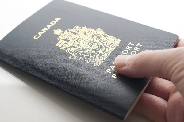 Handing Canadian passport — 스톡 사진