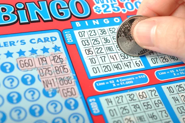 Scratching lottery ticket called bingo. — Stock Photo, Image