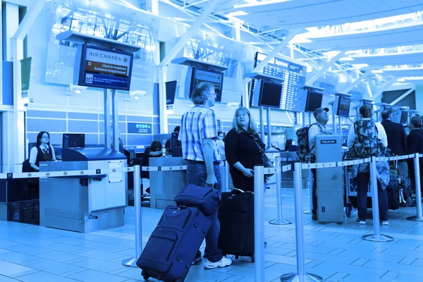 Close up Air Canada registration desk with blue toned — Stock Photo, Image