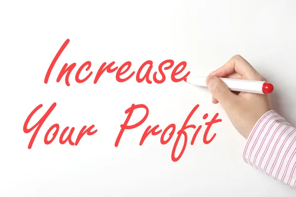 Business woman writing increase your profit word on whiteboard — Stock Photo, Image