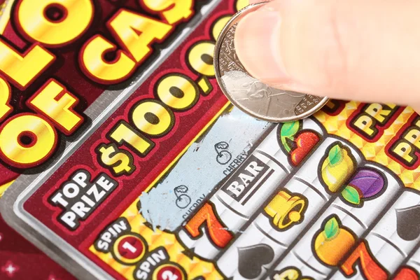 Close up woman scratching lottery tickets. — Stock Photo, Image