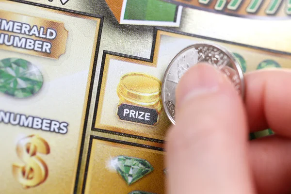 Close up woman scratching lottery tickets. — Stock Photo, Image