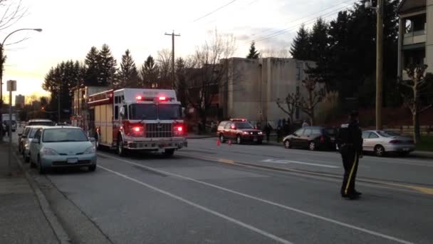 A red fire truck stopping on road for  battling apartment complex fire — Stock Video