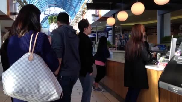 People line up for buying drink inside shopping mall in Burnaby BC Canada. — Stock Video