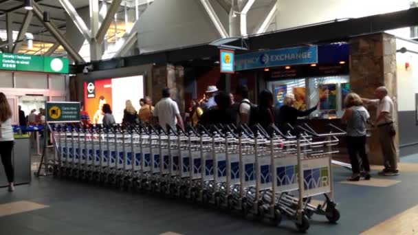 Passengers with luggage inside YVR airport in Vancouver BC Canada. — Stock Video