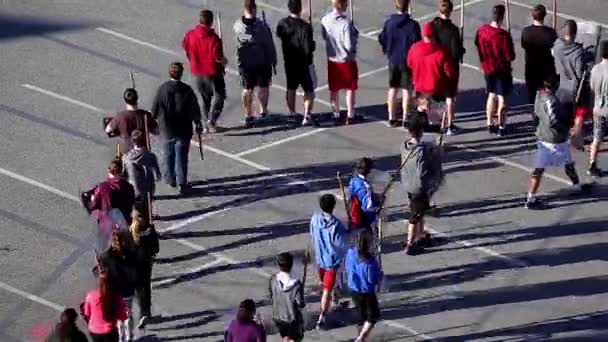 Policeman showing special forces shields helmets against crowd for young people — Stock Video