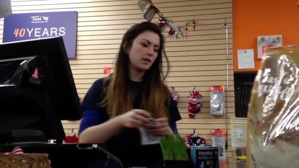 Man paying cat dry food at pet store in Vancouver BC Canada. — Stock Video