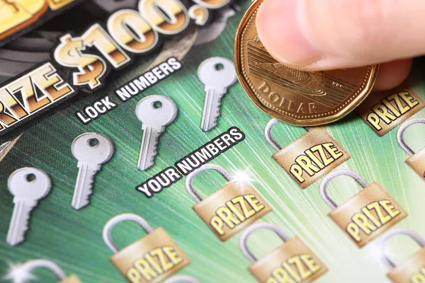 Close up woman scratching lottery tickets. — Stock Photo, Image