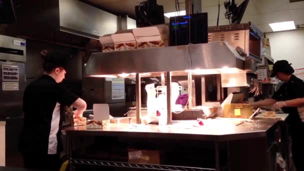 Worker preparing food for customer inside KFC store in Coquitlam BC Canada. — Stock Video