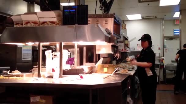 Worker preparing food for customer inside KFC store in Coquitlam BC Canada. — Stock Video