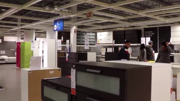 One side of people shopping their furniture  inside Ikea store — Stock Video