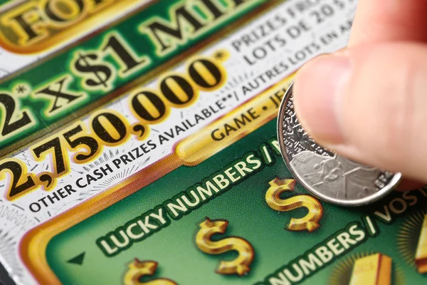 Close up woman scratching lottery tickets — Stock Photo, Image