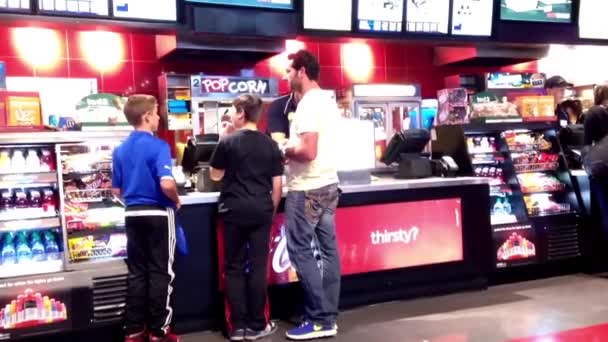 People line up for buying food at cinema — Stock Video