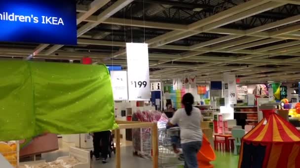 One side of people shopping their furniture inside Ikea — Stock Video