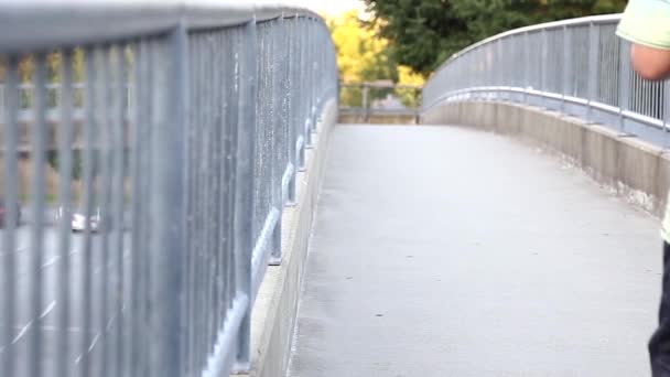 Low angle of people walk in on the bridge — Stock Video