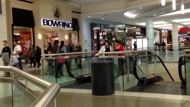 Busy escalators in Metropolis shopping mall in Burnaby BC Canada — Stock Video