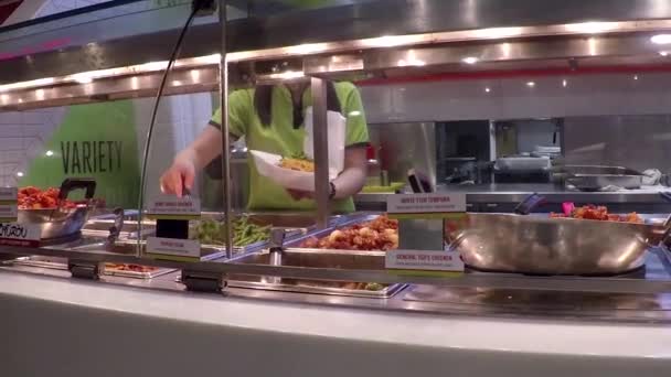 Customers choosing food for their meal in food court area — Stock Video