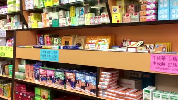 Motion of Chinese medicine on display shelves — Stock Video