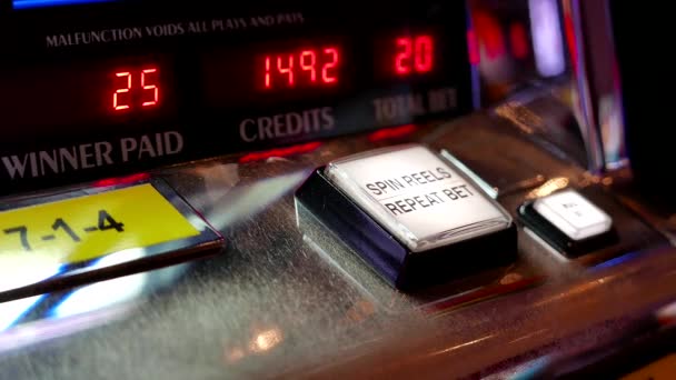 Close up woman pressing spin reels button on slot machine inside Hard Rock Casino — Stock Video