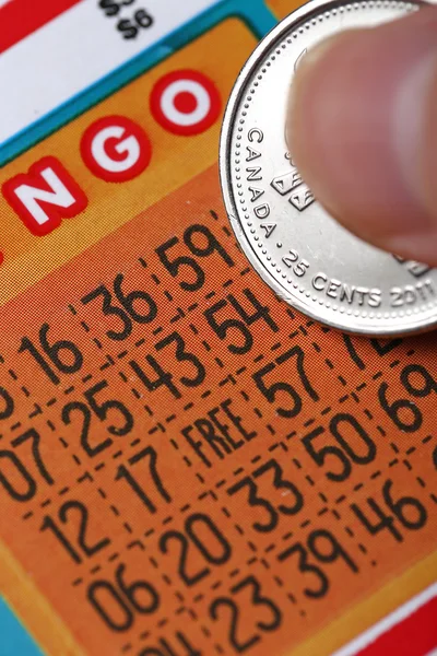 Woman scratching lottery ticket — Stock Photo, Image