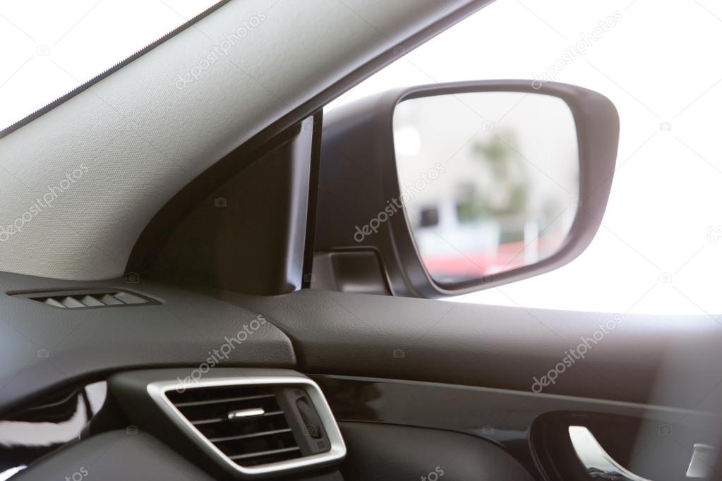 Look in the side mirror on the car