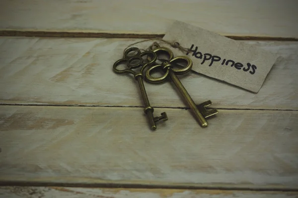 Antique keys on wooden background — Stock Photo, Image