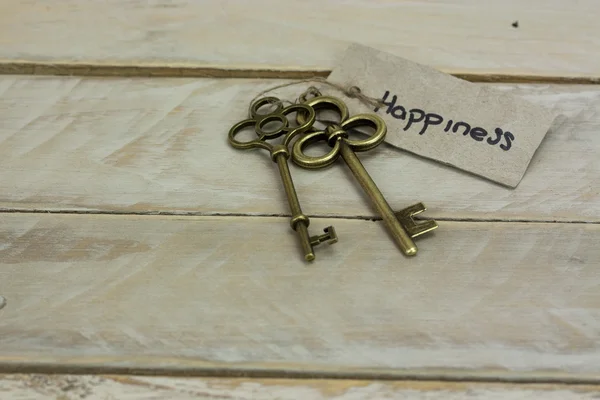 Antique keys on wooden background — Stock Photo, Image