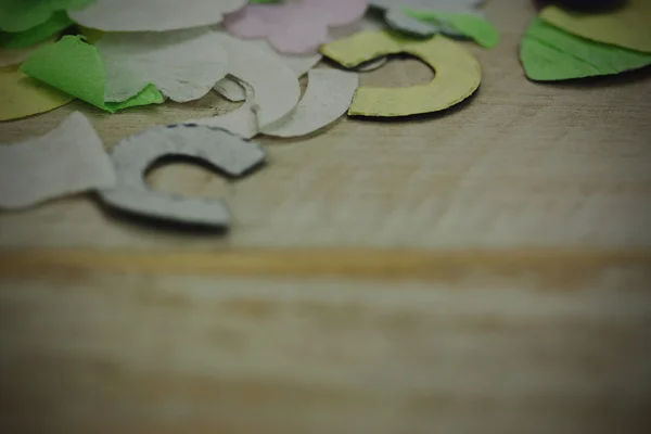 Confetti on a wooden background — Stock Photo, Image