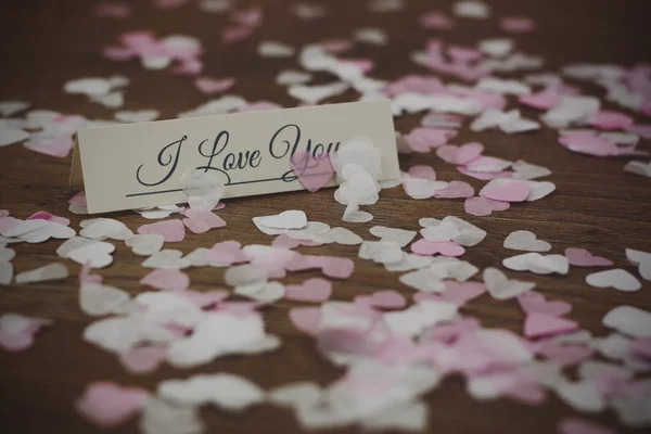 Marque de lieu entourée de confettis en forme de coeur — Photo
