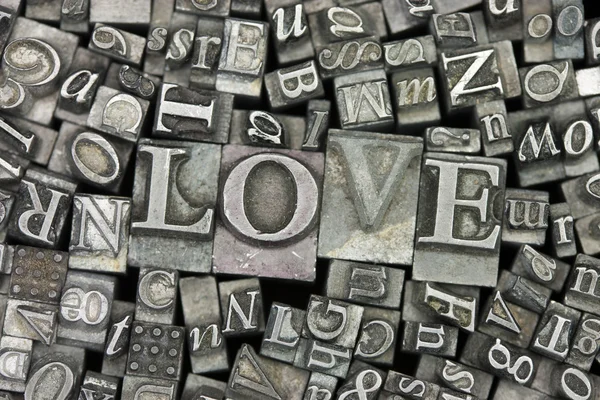 Close up of typeset letters with the word Love — Stock Photo, Image