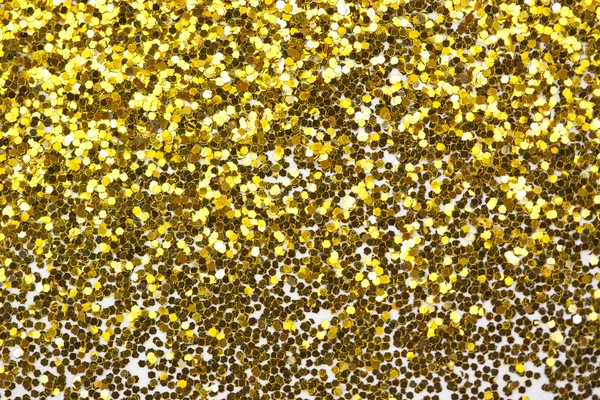 Close up a fine shining gold glitter — Stock Photo, Image