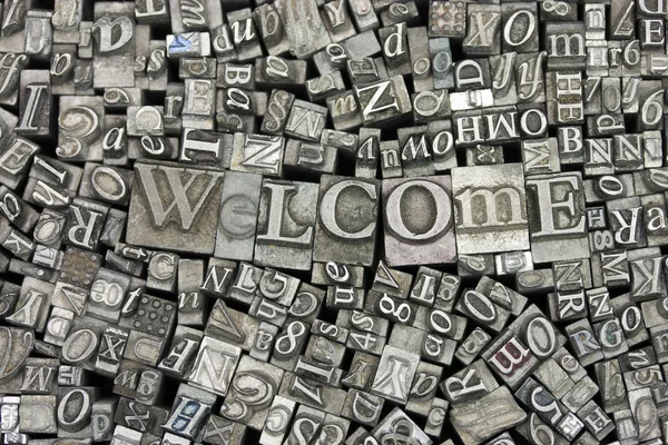 Närbild på monterat brev med ordet Välkommen — Stockfoto