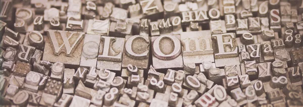 Close up van ✓ letters met het woord Welkom — Stockfoto