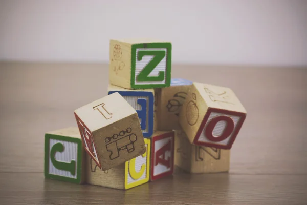 Childrens blocks on a wooden floor — Stock Photo, Image