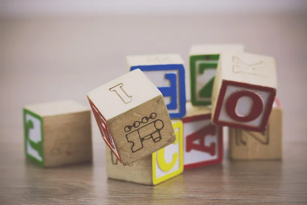 Childrens blocks on a wooden floor — Stock Photo, Image