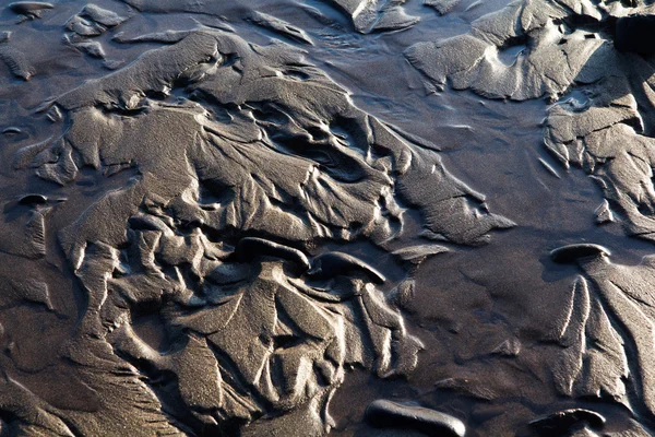Close up de areia molhada na praia — Fotografia de Stock