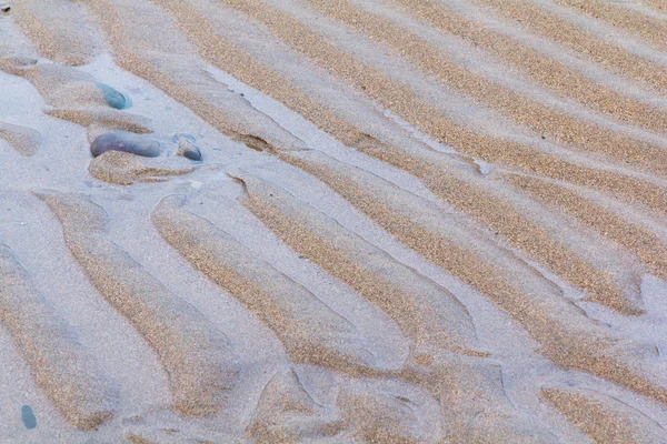 ビーチでの濡れた砂のクローズ アップ — ストック写真